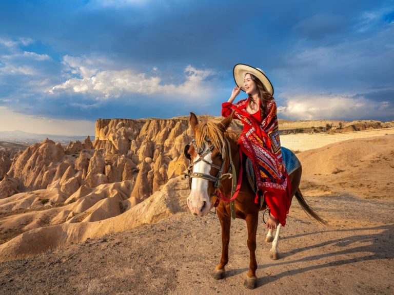 tourists enjoy ride horses cappadocia turkey