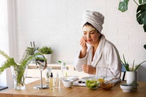 Woman having skin care at home