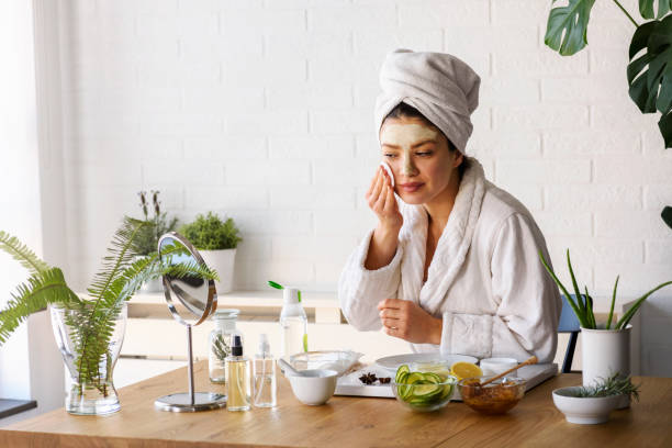 Woman having skin care at home
